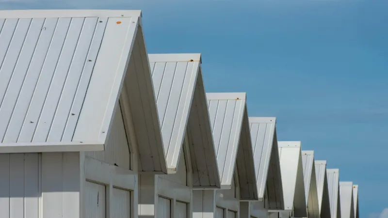 A-frame metal roof pattern with corrugated panel geometry — Rhino Roofing and Exteriors