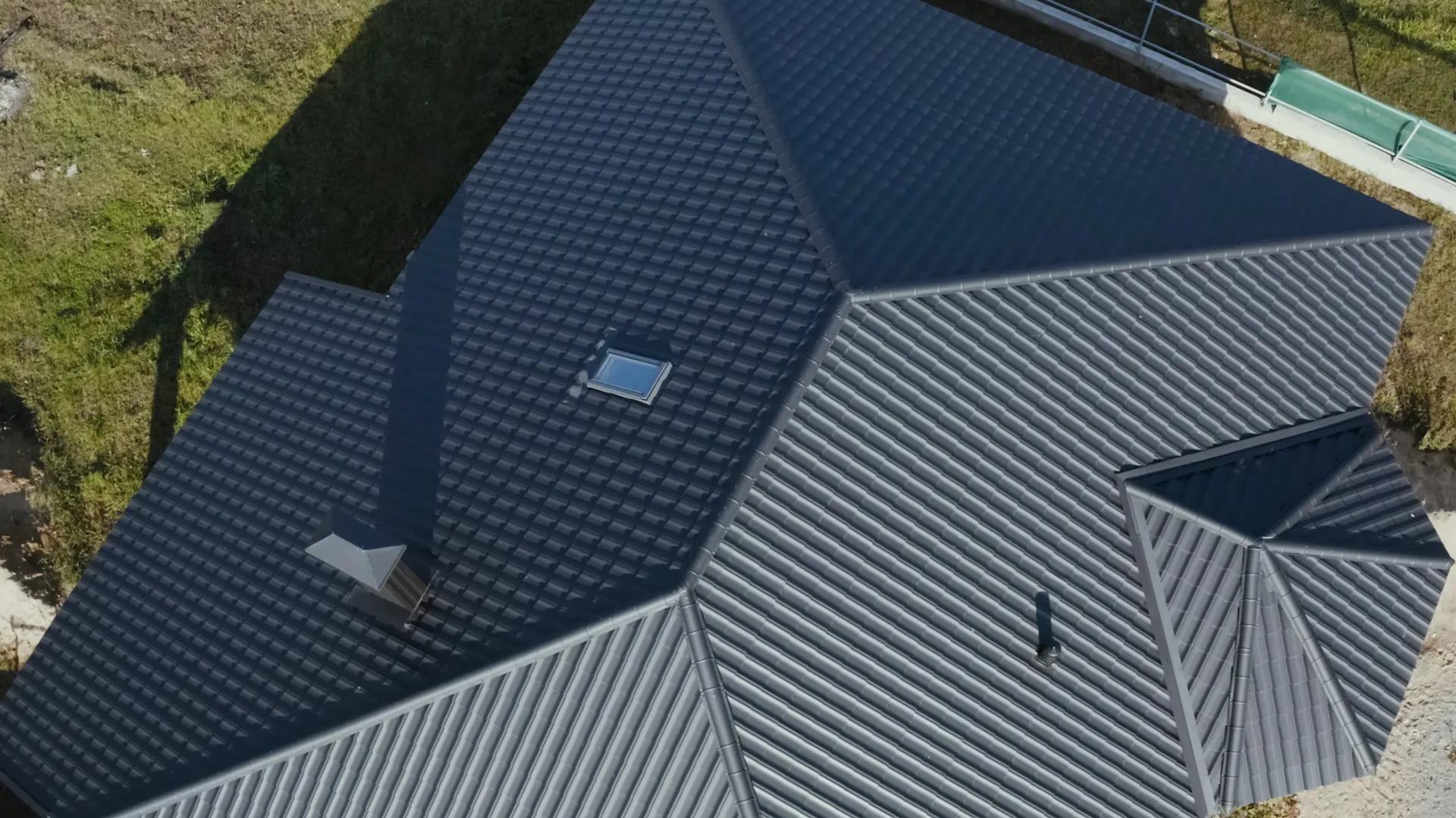 Metal roof overhead geometry — abstract roofing craftsmanship — Rhino Roofing and Exteriors
